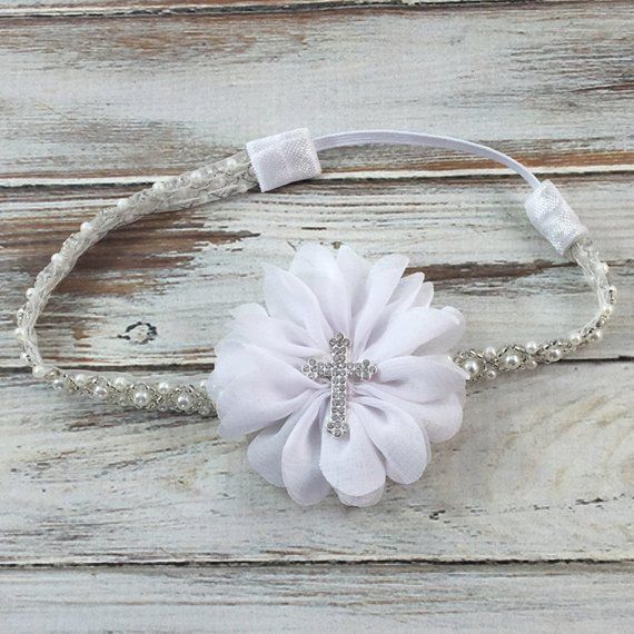 Platinum Collection- Gorgeous Pearl and Beaded Headband with an white "Luciana" flower accented with a rhinestone cross! This flower is appx 3"This is absolutely STUNNING!! Perfect for Flower Girl, Baptism, Christening, or First Communion Headband. Very soft, comfy and elegant. Perfect for a Special Occasion!Perfect for Flower Girls, Any Special Occasions, Photo Shoots, and a beautiful accessory for everyday wear!Sizing Options:Newborn - 12" extends to 13"Infant - 14" extends to 15.5"Child - 15. White Matching Headband For Baptism, Elegant White Flower Headband, Baptism Headband Baby Girl, White Flower-shaped Hair Accessories With Matching Headband, Baptism Headband, Couture Accessories, Rhinestone Cross, Beaded Headband, White Headband