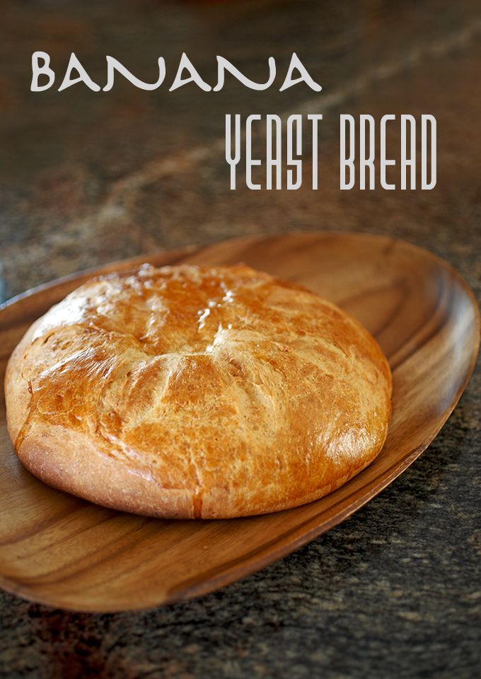 two pieces of bread sitting on top of a wooden plate with the words banana yeast bread