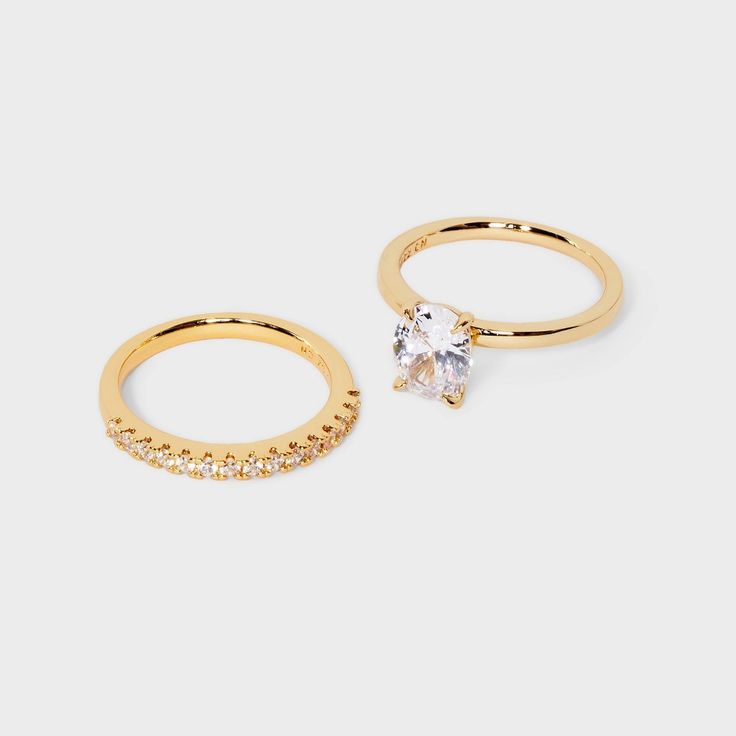 two gold rings, one with an oval cut and the other with small round stones