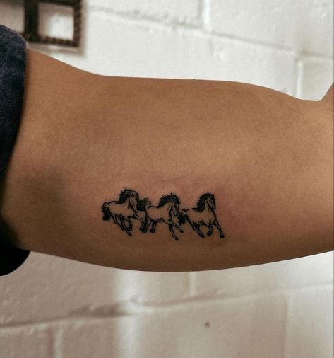 three horses tattoo on the arm