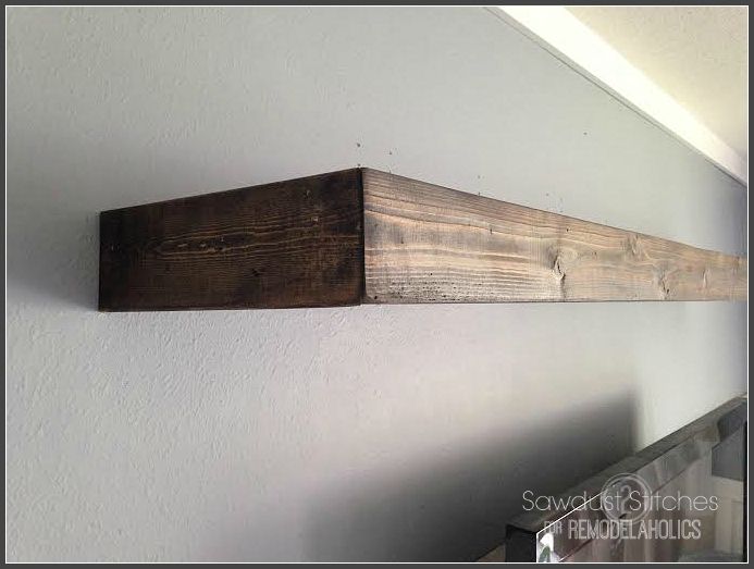 two pieces of wood are hanging on the wall