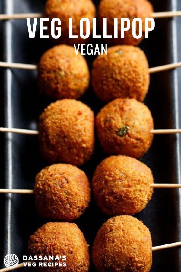 some food is sitting on a grill with the words veg lollipop vegan