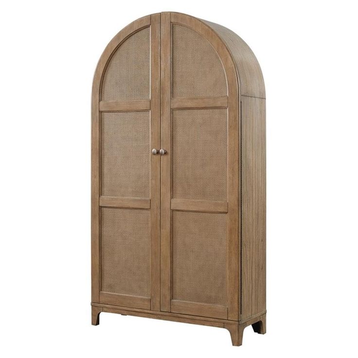 an arched wooden cabinet with wicker doors on the top and bottom, against a white background