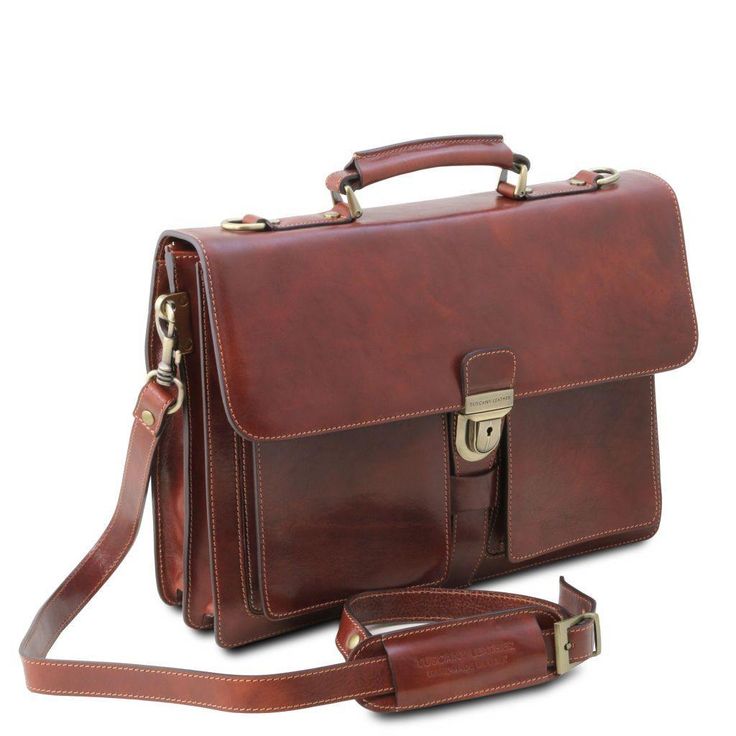 Experience the elegance of a true Italian leather briefcase. Handcrafted with precision by skilled artisans in Tuscany, this briefcase embodies the essence of Italian craftsmanship. Made from 100% full-grain leather, it merges luxury and functionality seamlessly. Ideal for professionals, its semi-rigid structure and three compartments ensure ample space for documents, a laptop, and other essentials. Featuring antique brass or nickel hardware, this italian leather briefcase is built to last. The Italian Leather Briefcase For Formal Use, Elegant Business Bag In Cognac, Elegant Business Cognac Bag, Elegant Cognac Business Bag, Elegant Cognac Bag For Business, Elegant Cognac Laptop Bag For Business, Elegant Smooth Grain Shoulder Bag For Business Trips, Elegant Cognac Bag For Business Trips, Elegant Shoulder Bag With Smooth Grain For Business Trips