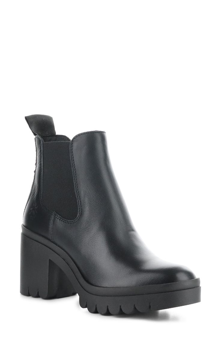 A treaded sole and block heel lift this classic Chelsea boot featuring logo detailing on the pull tab and a cushioned footbed. 3" heel; 1 1/4" platform 4 1/2" shaft Pull-on style with elastic gore insets Cushioned insole Leather upper/synthetic lining/rubber sole Made in Portugal Women's Shoes Chelsea Boot Women, Fly London, Chelsea Boot, Pull Tab, Chelsea Boots, Women's Shoes, Block Heels, Rubber Sole, Chelsea