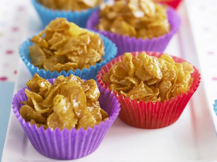 there are many different types of muffins on the tray