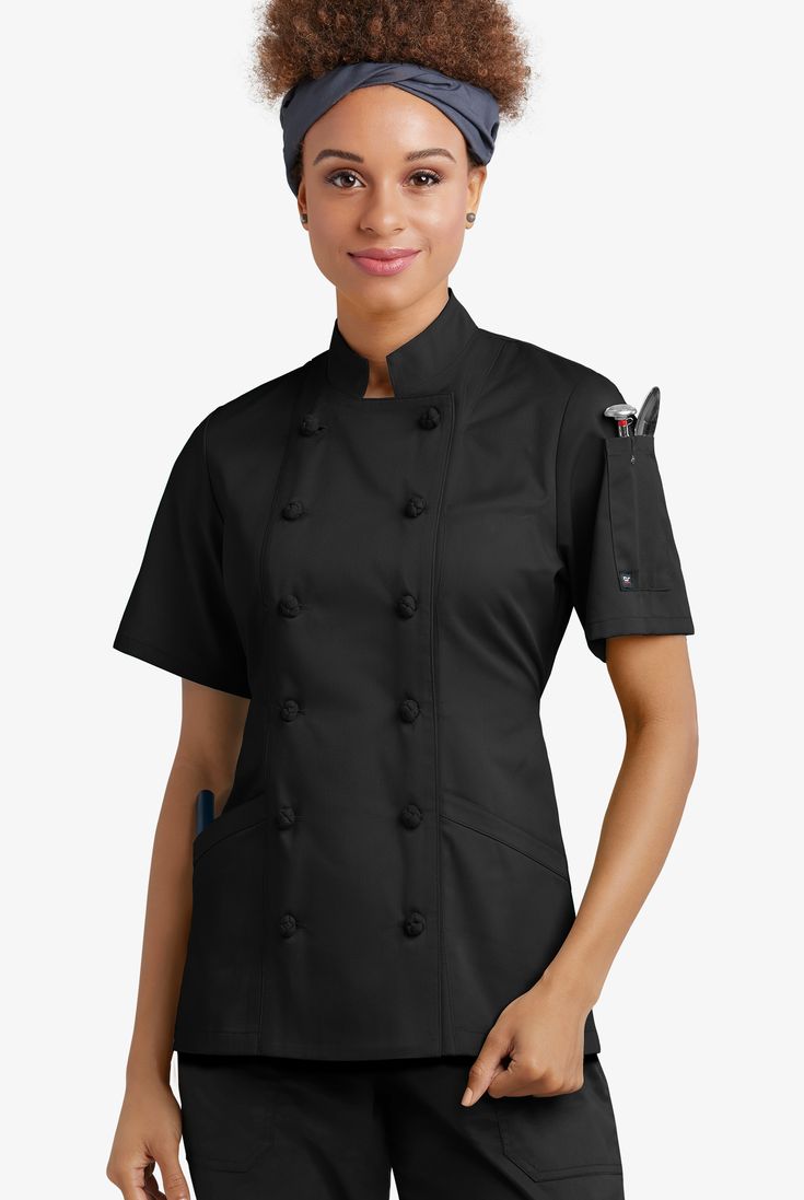 The Women's Short Sleeve Chef Coat with Knotted Buttons features a tailored fit and a secure knotted button closure. It also features turn back cuffs and a reversible closure. For storage, this chef coat includes 2 front pockets and a thermometer pocket on the left sleeve. For added shape, this chef coat features princess seams and a back tie. Made of 65/35 poly/cotton. Approximate length for size M is 27.5". • Modern fit • Reversible closure • Knotted button closure • Total 3 pockets • 2 front Chef Coats, Chef Uniforms, Cobbler Aprons, Chef Styles, Chef Jackets, Chef Shirts, Chef Pants, Chef Wear, Chef Clothes