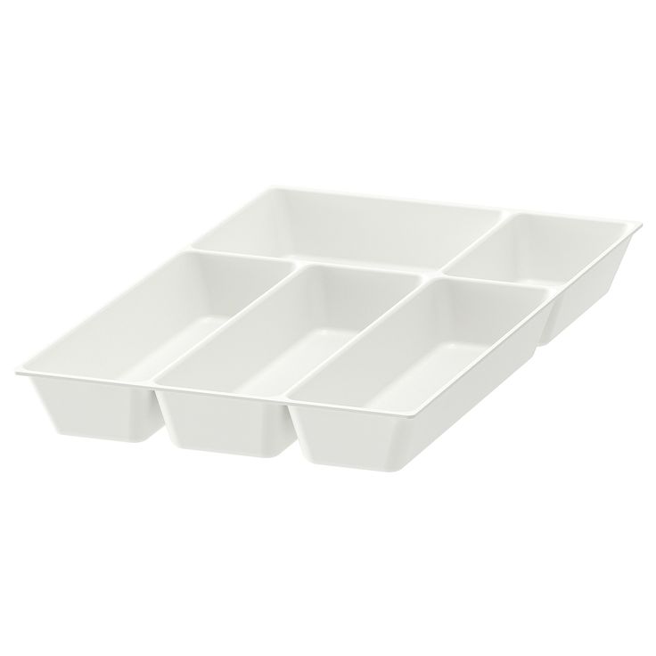 four white dishes sitting on top of each other