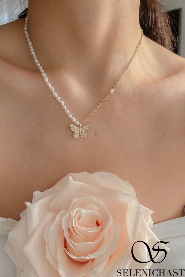 DETAILS Plating: 14K Gold Materials: 14K Gold on Brass, Freshwater Pearl, Cubic Zirconia Measurements: Length: 14.17"(36cm) + Extender: 1.97"(5cm) Pendant Diameter: 0.39"(1cm) Weight: 5.29g Elegant Butterfly Necklace For Formal Occasions, Elegant Pendant Necklace With Butterfly Charm, Elegant Butterfly Pendant Necklace, Elegant Formal Butterfly Necklace, Elegant Butterfly Pendant Necklace As Gift, Elegant Butterfly Pendant Necklace For Gift, Elegant Butterfly Pendant Necklace For Wedding, Elegant White Butterfly Necklace With Clavicle Chain, Formal White Necklace With Butterfly Charm