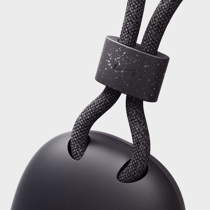 a close up of a black object with a knot on it's back end