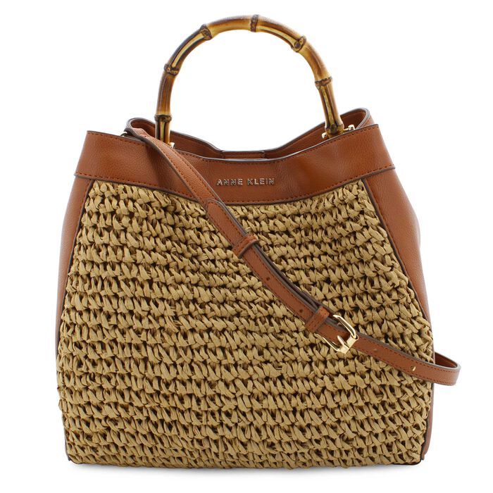 Bask in Summer Style with the Anne Klein Straw Tote where timeless design meets boardwalk-ready charm. This stylish and spacious tote features an attractive woven straw design with a bamboo handle, making it a natural choice for a casual outing during those warmer months. It comes with a matching zippered pouch that can be used with the bag or carried by itself.  synthetic upperwoven straw exterior trimmed with faux-leatheropen-top design with magnetic-snap closurefabric-lined interior with zip Summer Handbags 2024, Summer Purses 2024, Straw Handbags Summer, Anne Klein Bags, Straw Design, Leather Zipper Pouch, Butterfly Prints, Shopping Tote Bags, Summer Purses