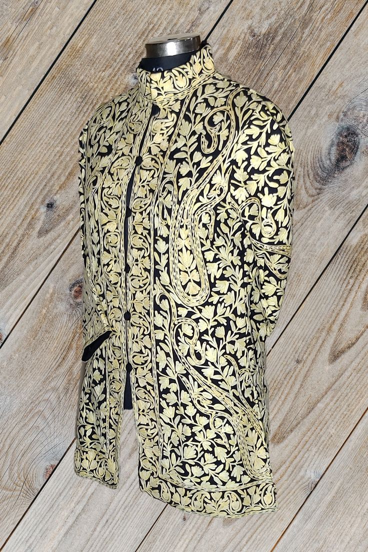 Short Kashmiri Jacket, Wedding Indian Jacket, Luxury Jacket A Kashmiri Jacket with All Over  Aari Embroidery (Front & Back) This Kashmiri jacket Makes you stand apart with its vivid colors and paisley embroidery, The base color is Black and Lemon Colour  Paisley-Aari Embroidery is done all over the jacket, the embroidery is done by brilliant Kashmiri artisans.  Embroidery      : Aari Work Length             : 40 Inches (101.6cms) [Customizable] Colour             : Black Base With Brown Embroide Elegant Nehru Jacket With Resham Embroidery For Fall, Festive Fitted Outerwear With Chikankari Embroidery, Ceremonial Gold Nehru Jacket With Traditional Drape, Traditional Fall Bandhgala With Intricate Embroidery, Traditional Bandhgala With Intricate Embroidery For Fall, Gold Bandhgala With Intricate Embroidery For Transitional Season, Gold Bandhgala With Intricate Embroidery, Fall Bandhgala With Intricate Embroidery, Elegant Fall Outerwear With Zari Work