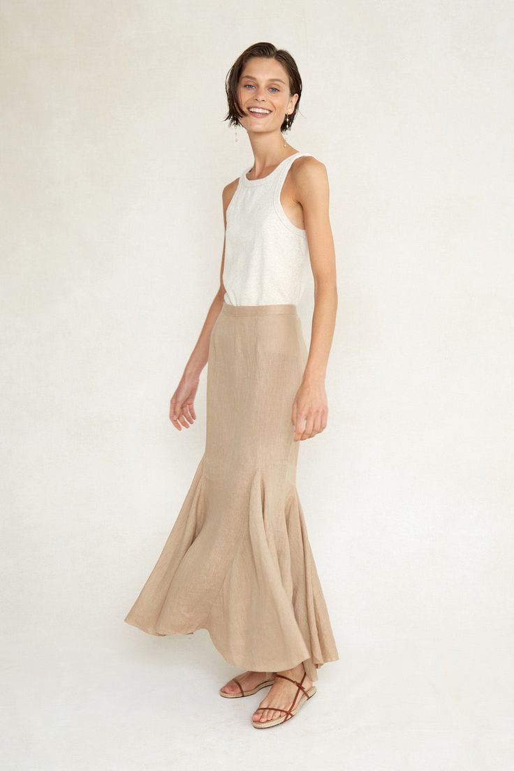 Form fitting linen skirt with beaded trim in a pale nude hue. Each step accentuates the flowing movement of the ruffled panels. 100% Linen. Size 1: 14" Waist, 19" Hip, 99" Bottom Width, 35.75" Total Length. Fits sizes 24-26. Size 2: 15" Waist, 20" Hip, 100" Bottom Width, 36.25" Total Length. Fits sizes 26-28. Size 3: 16" Waist, 21" Hip, 101" Bottom Width, 36.75" Total Length. Fits sizes 28-30. Hand wash, lay flat to dry. Made in India. Elegant Cream Ruffled Skirt Bottoms, Elegant Cream Ruffled Skirt, Elegant Beige Tiered Skirt Bottoms, Elegant Tiered Cream Maxi Skirt, Fitted Beige Tiered Skirt, Chic Beige Ruffled Skirt Bottoms, Beige Ruffled Skirt Bottoms, Elegant Linen Lined Skirt, Elegant Linen Bottoms With Lined Skirt