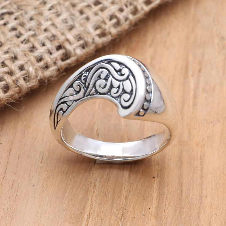 Elegance is at your fingertips when you wear this simple yet stunning ring from Dewa Arimbawa. Crafted from sterling silver the ring features a curved front the artisan engraves with traditional Balinese designs giving the piece an exquisite touch. Sterling Silver Engraved Open Ring With Intricate Design, Engraved Sterling Silver Filigree Open Ring, Etched Sterling Silver Open Ring Jewelry, Etched Sterling Silver Open Ring, Elegant Etched Sterling Silver Rings, Elegant Engraved Sterling Silver Stackable Rings, Elegant Adjustable Engraved Sterling Silver Ring, Silver Cocktail, Set Ring