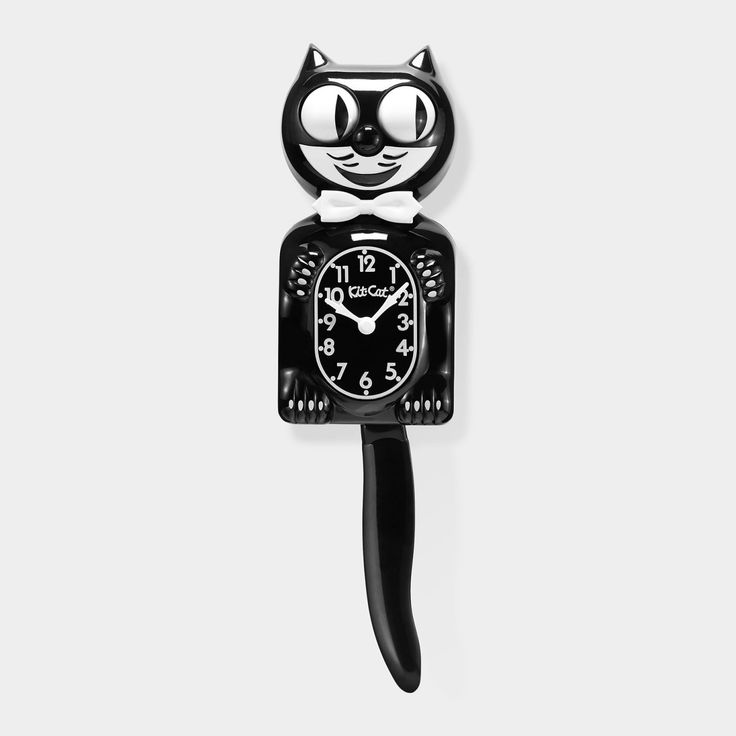 a black cat clock is hanging on the wall