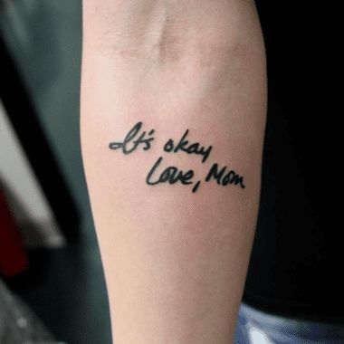 a person with a tattoo that says it's okay to leave mom on their arm