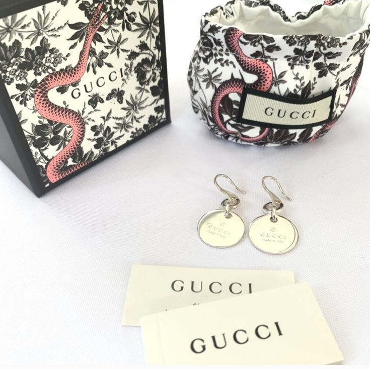 Authentic,New,Sterling Silver Earrings With Gucci Logo,Aprox.1-3/4 L3/4 W3/16h,Made In Italy,French Hook, Back Is Blank,Possibility For Engraving. Classic Gucci Earrings For Anniversary, Gucci Round Earrings For Formal Events, Gucci Round Earrings For Formal Occasions, Gucci Luxury Round Earrings, Luxury Gucci Earrings, Luxury Round Gucci Earrings, Gucci Sterling Silver Earrings For Formal Occasions, Gucci White Gold Sterling Silver Earrings, Gucci Luxury Sterling Silver Earrings