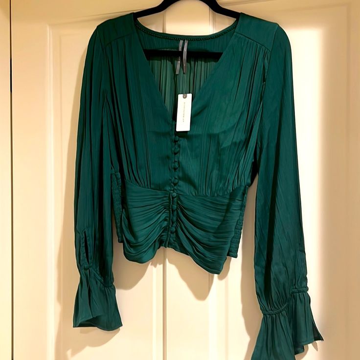 This Blouse Is Just Beautiful And Comes From Anthropologie. It’s A Size Small And Has Elegant Details Like Small Little Buttons And Ruching. Very Flattering. This Can Be Dressed Up Or Down And Paired With Jeans Or A Long Skirt And Can Be Worn At The Office. I Think This Would Make A Great Addition To Your Wardrobe. New With Tags. Green V-neck Top For Date Night, Fitted Green Blouse For Date Night, Green Top For Date Night In Fall, Elegant Green Blouse For Date Night, Green V-neck Blouse For Date Night, Just Beautiful, Long Skirt, The Office, Anthropologie