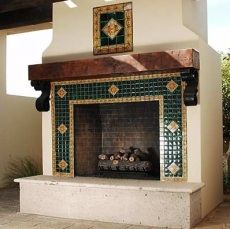 an outdoor fireplace with tile work on the mantle