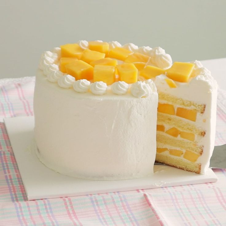 a white cake with yellow and white frosting