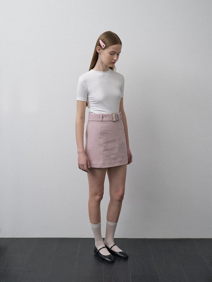 This product, the Janie Belted Skirt, is designed to offer a sleek and stylish addition to any fashion-forward wardrobe. The skirt's A-line cut is flattering on a variety of body types, and the included belt cinches at the waist for an added touch of elegance. With its clean lines and minimalist design, this skirt is a versatile piece that can be dressed up or down. - The Janie Belted Skirt features an A-line cut that gracefully complements the figure.- It comes with a matching belt that highlights the waist and adds a sophisticated detail.- The skirt is secured with a discreet back zipper, allowing for a seamless and comfortable fit.- Constructed with a smooth, lightweight fabric, it provides a comfortable wear suitable for different seasons. Belted Fitted Mini Skirt, Chic Fitted Mini Skirt With Belt Loops, Fitted Belted Mini Skort, Fitted Belted Mini Skirt, Belted Fitted Mini Skirt Skort, Chic Mini Skirt Bottoms With Belt, Summer Fitted Belted Skirt, Fitted Mini Skirt Skort With Belt, Fitted Mini Skort With Belt