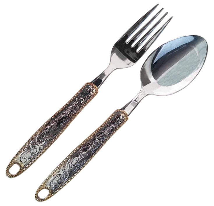 two forks and spoons with ornate designs on them