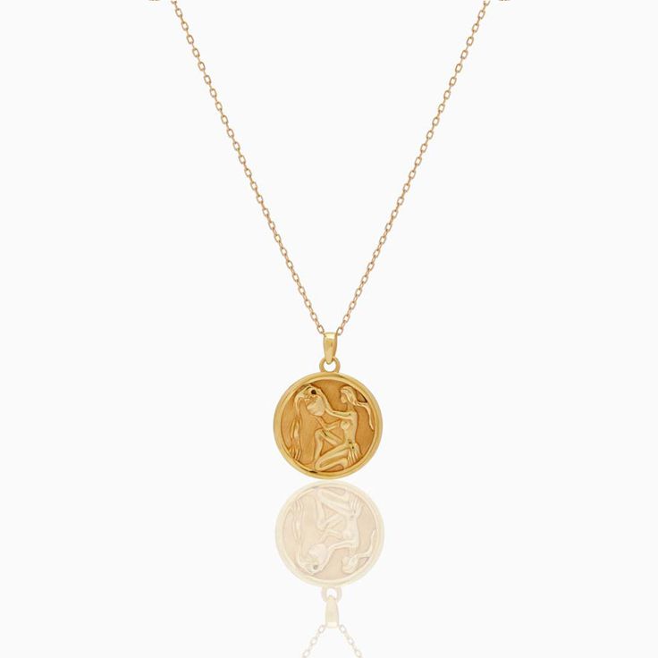 Aquarius Zodiac Coin Pendant - Classic. Crafted for you to flaunt your star sign, this necklace goes with every outfit and will give a hint of sentiment wrapped in luxury to your style. The Diamond Bezel around the Gold Coin blends into a delicate yet beautifully detailed piece. Coins 5. 4 grams of 18k yellow gold and 0. 44 ct natural diamonds Fine Jewelry Zodiac Sign Necklace As Gift, Luxury Gold Plated Zodiac Necklaces, Gold Zodiac Sign Fine Jewelry Necklace, Celestial Zodiac Sign 14k Gold Necklaces, 14k Gold Celestial Zodiac Necklaces, Fine Jewelry Zodiac Sign Necklace For Gift, Luxury Zodiac Sign Necklaces, Zodiac Sign Fine Jewelry Necklace Gift, Zodiac Sign Medallion Amulet Necklace