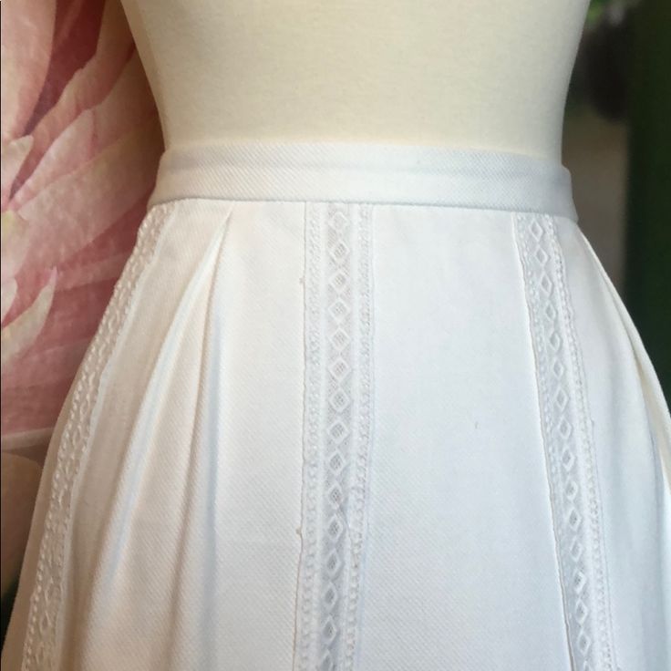 This Skirt Has Been Worn Only A Few Times. It Has No Stains And Looks Brand New. It Is Made Of 100% Cotton And Has White Hardware. It Features Lace Eyelet Stripes Down The Skirt. Fitted Cotton Skort For Daywear, Fitted Skort For Daywear, Fitted Cotton Pleated Skirt For Daywear, Classic Cotton Skort With Lined Skirt, Classic Cotton Lined Skort, Fitted Flared Mini Skirt For Daywear, Fitted Pleated Skirt For Spring Daywear, Elegant Short Cotton Skirt, Classic Fitted Cotton Skort