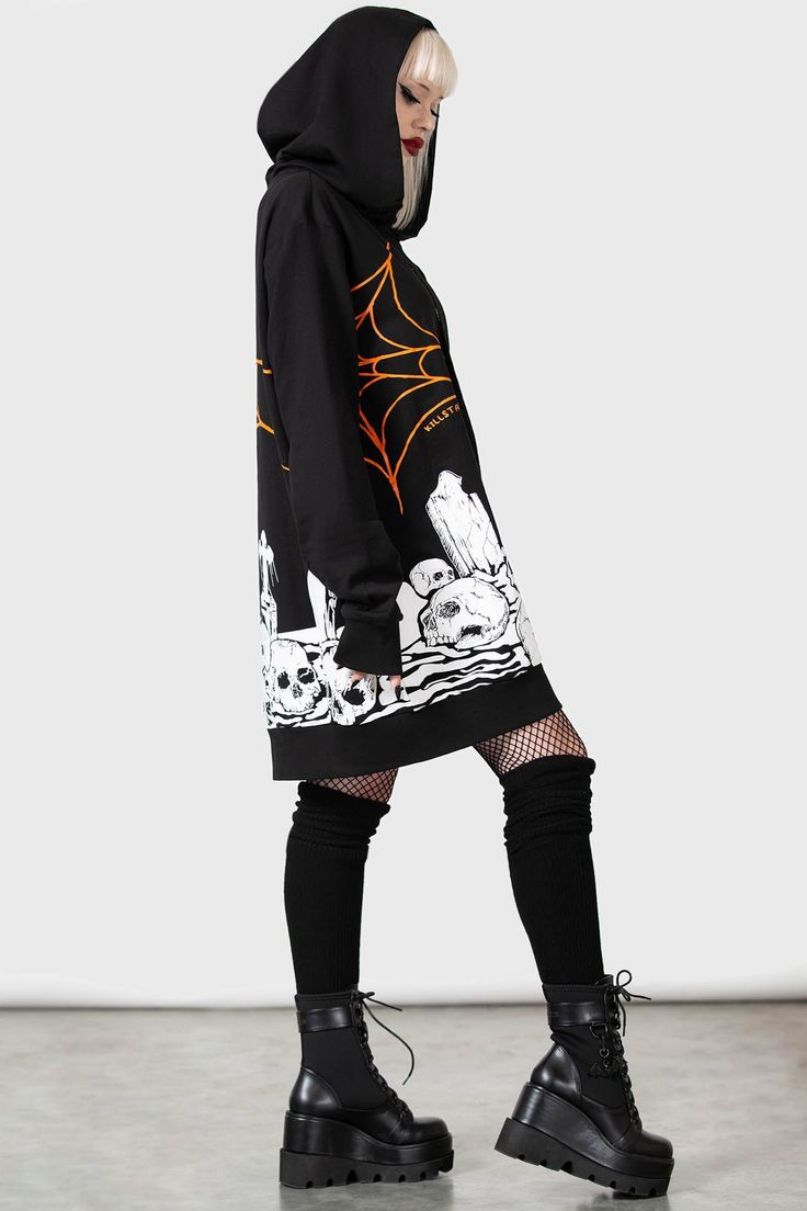 PUMPKIN.- Soft, light stretch cotton.- Statement, all-over, contrasting custom print.- XL hood with drawstring.- Long, cuffed sleeves.- Fitted.- Unisex, so it's for everyone.Model with blonde hair is 5ft 4 and wears a size L for an oversized look.Model with ear stretchers is 6ft 1 and wears a size L.with KILLSTAR branding, 100% Cotton. Alternative Style Cotton Hoodie For Fall, Alternative Cotton Halloween Hoodie, Alternative Graphic Print Hoodie For Fall, Spooky Black Streetwear Hoodie, Spooky Black Hoodie For Streetwear, Urban Cotton Hoodie For Halloween, Spooky Long Sleeve Winter Hoodie, Halloween Urban Cotton Hoodie, Halloween Cotton Sweatshirt With Adjustable Hood