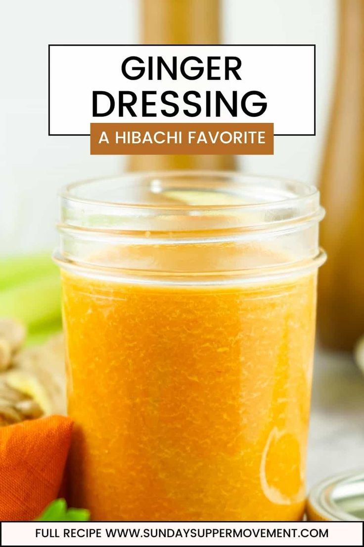 a glass jar filled with orange liquid next to bananas