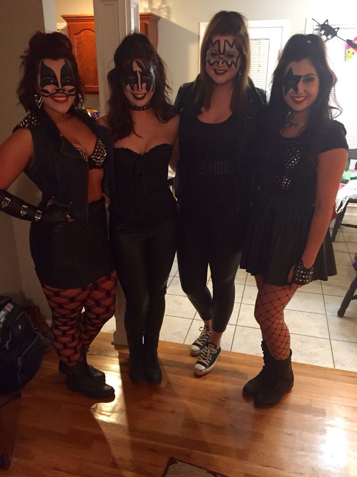 three women in costumes posing for the camera