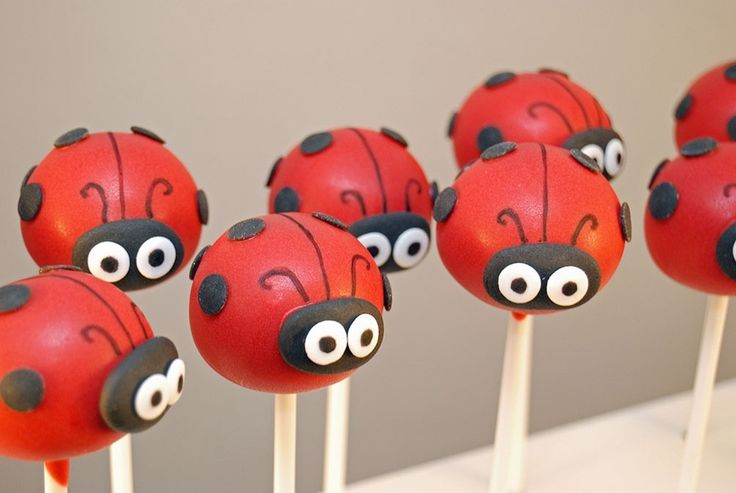 some cake pops with ladybugs on them