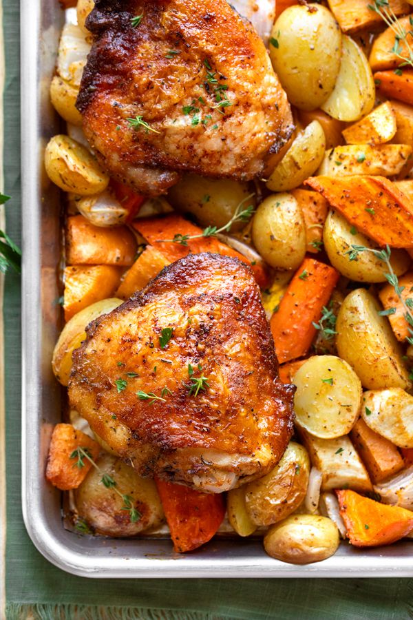 chicken, potatoes and carrots in a roasting pan