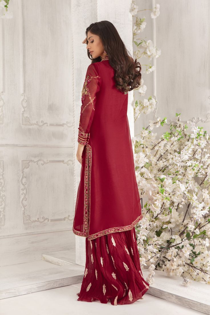 Gorgeous delicate floral embroidered shirt on Pure Silk Net in beautiful Maroon hue adorned with dabka, gota, crystals, beads and resham work. Hand block printed borders, gota details & stylishly sequin embellished dupatta add a festive element to this outfit This stunning front open style shirt is paired with crushed jacquard dhaka pants. A quintessential wardrobe for all Festivities. Shirt Fabric: Pure Silk Net Shirt Length: 45” (Customisable, mention in order notes)Dhaka Fabric: Jacquard Khaa Net Shirt, Floral Embroidered Shirt, Resham Work, Designer Outfit, Crystals Beads, Net Dupatta, Pakistani Designers, Shirt Fabric, Shirt And Pants