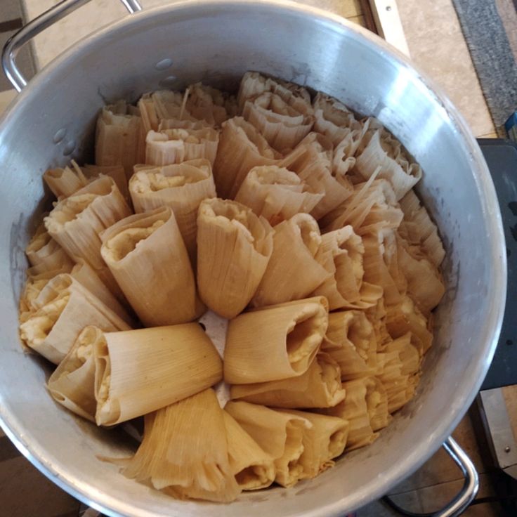 some kind of food that is in a pot on the stove top and ready to be cooked