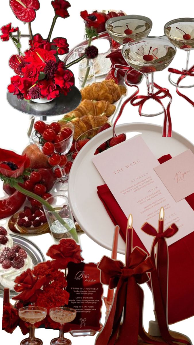 a table topped with lots of red flowers and plates