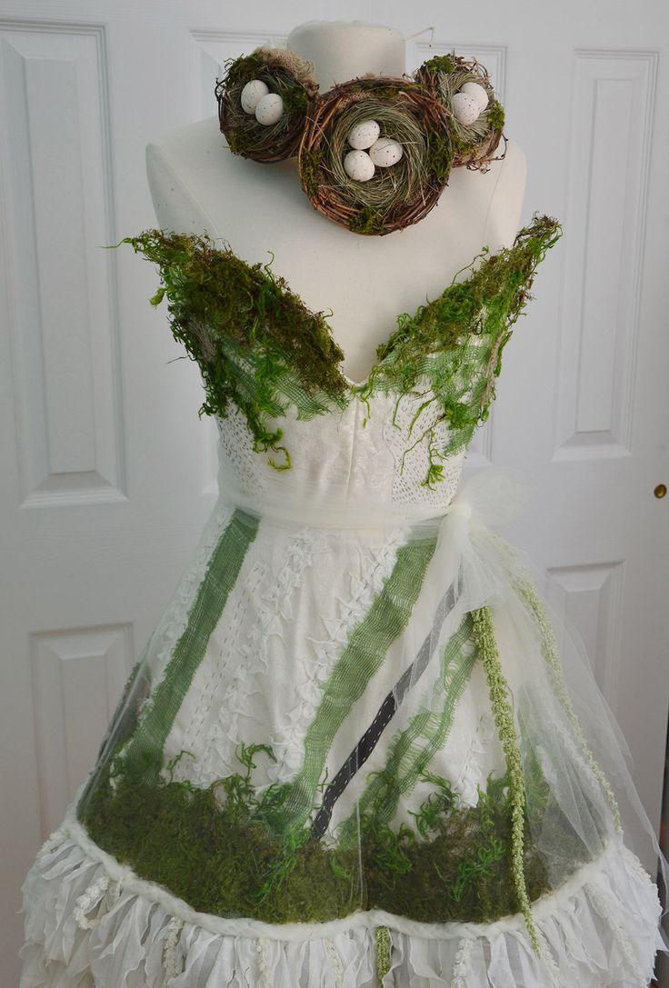 a white dress with moss and eggs on it