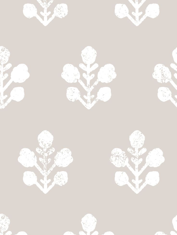 a white flower pattern on a gray wallpaper with an arrow in the center and two leaves at the bottom