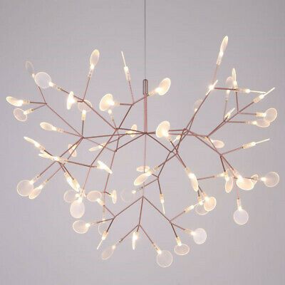 a chandelier with lights hanging from it's branches in the shape of a snowflake