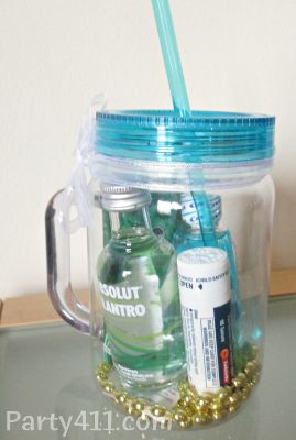 there is a jar with some bottles in it and a straw sticking out of the lid