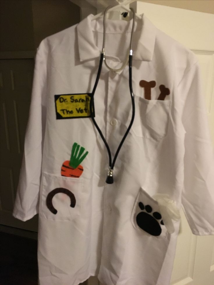 a doctor's coat is hanging on the door with stickers attached to it