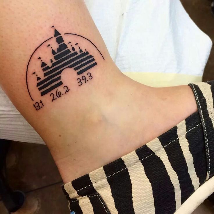 a woman with a tattoo on her wrist has a castle in the middle of it