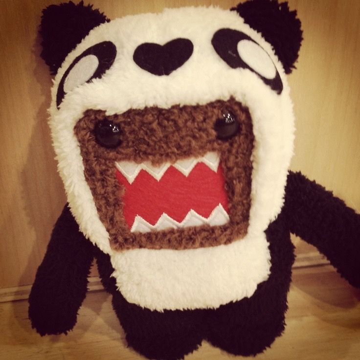 a stuffed animal that has been made to look like a bear with teeth and eyes