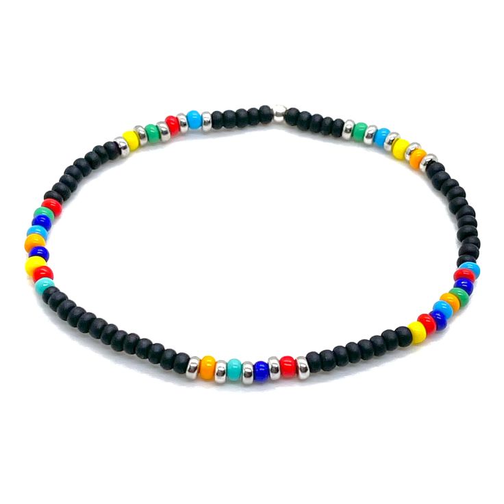 Perfect for Guys who Crave Beach Vibes Year Round Sea glass center bead; glass seed beads; silver-tone glass seed bead disks; finished with a sterling silver bead. Stretch style. Waterproof. Perfect solo or stacked. Handmade in NYC. Black Heishi Beads For Beach, Beach Black Heishi Beads Bracelet, Black Bracelets With Letter Beads For Beach, Black Beaded Bracelets For Summer With Round Beads, Black Letter Beads Bracelet For Beach, Adjustable Polished Bead Bracelets For Beach, Summer Adjustable Beaded Bracelets With Black Beads, Multicolor Beaded Bracelets With Black Beads For Beach, Adjustable Polished Beads Bracelets For Beach