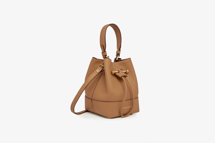 Strathberry - Osette - Osette - Beige Timeless Brown Top Handle Bucket Bag, Everyday Cognac Bucket Bag With Detachable Strap, Chic Leather Bucket Bag For Travel, Elegant Bucket Bag With Leather Handles, Elegant Bucket Bag With Handles For Travel, Chic Bucket Bags With Gold-tone Hardware, Chic Cognac Bags With Handles, Elegant Travel Bucket Bag With Handles, Chic Bucket Bag With Detachable Strap For Travel