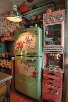 an old fashioned refrigerator in a kitchen next to a stove top oven and microwave on the wall