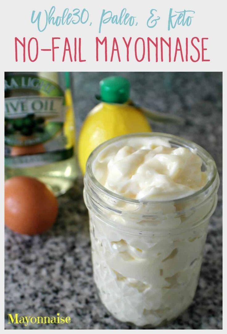 a mason jar filled with whipped cream next to eggs and lemons