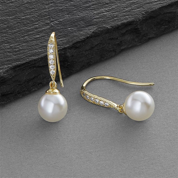 Micro Pave French Wire Earrings -Ivory Pearl Drops The look of classic pearls is exquisitely redefined by these romantic vintage-inspired drop earrings. Boasting subtle 8mm ivory pearls and meticulous micro-pave Cubic Zirconia, these 14K gold plated bridal earrings bring the perfect touch of understated elegance. Elegant Pearl White Earrings With Pearl Drop, Cream Pearl Drop Earrings For Formal Occasions, Elegant Pearl White Pearl Drop Earrings, Elegant Pearl White Earrings With Pearl Charm, Cream Pearl Earrings For Formal Occasions, Classic Pearl Bridal Earrings For Evening, Elegant Pearl Earrings With Pearl Pendant, Elegant Pearl Earrings With Pendant, Pearl White Pearl Earrings With Elegant Design