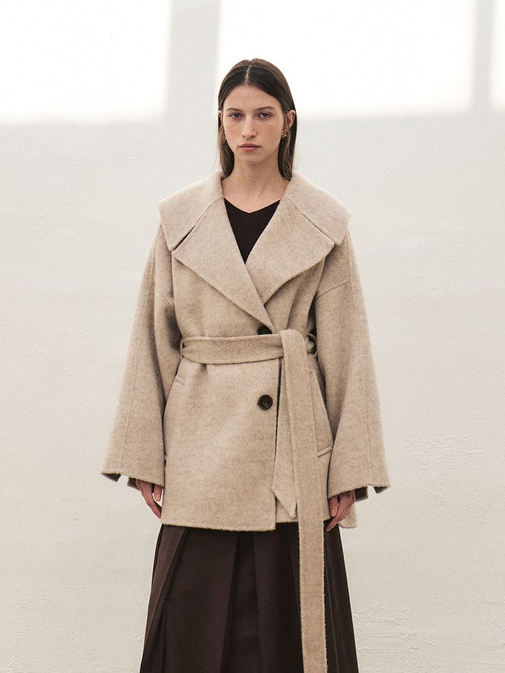 Editor's NotesRTF Camel Hair Wide Collar Half Coat is Feminine look with wide collar Handmade half coat. Loose-fit wool coat with a relaxed mood. This coat is a product that is active due to its back-centered corrugation.- It has a self-belt that can be attached to it, can create a wide outfit- a half-length lining with thickness- Highlight luxury using the Real Cow horn buttonMeasurements(in.)Size: XS, S, M- Sleeve Length From Center Back: 31.9 in. / 32.3 in. / 32.7 in.- Chest: 23.4 in. / 24.4 in. / 25.4 in.- Hem opening: 21 in. / 21.9 in. / 22.8 in.- Sleeve opening: 11.4 in. / 11.6 in. / 11.8 in.- Length: 32.3 in. / 32.7 in. / 33 in.*Model info: Height 5ft 7. / Bust: 30 in. / Waist: 24 in. / Hips: 34 in. / 'S' SIZE*Model info: Height 5ft 5. / Bust: 28.5 in. / Waist: 23 in. / Hips: 34 in. Half Coat Outfits For Women, Wide Outfit, Coat Outfits For Women, Cow Horns, Cape Coat, Coat Outfits, Signature Look, Feminine Look, Wool Coat