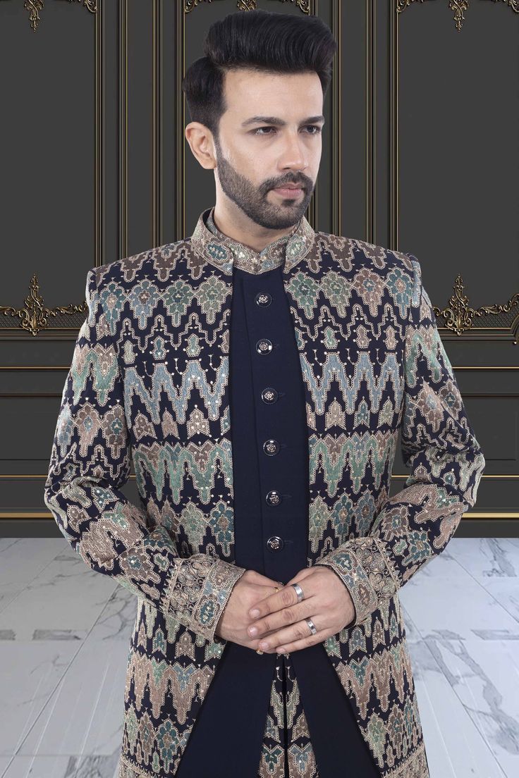 This Mens Sherwani is expertly designed with a unique open jacket style and adorned with intricate sequin and thread embroidery. Elevate your formal look with this exquisite piece, perfect for traditional events and special occasions. Enjoy the timeless elegance and sophisticated craftsmanship of this U2-S378 sherwani. Mens Sherwani, Formal Look, Open Jacket, Thread Embroidery, Formal Looks, Jacket Style, Timeless Elegance, Special Occasion, Sequin